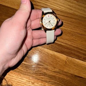 Women’s Michele watch with white silicon strap and gold dial
